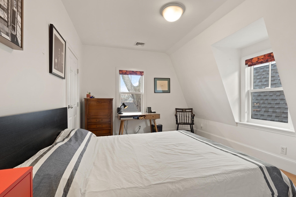 36 Gorham Street, Unit 3 Cambridge, MA 02138 - Photo 16 of 31 a bedroom with a bed and a dresser