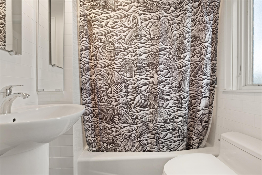 36 Gorham Street, Unit 3 Cambridge, MA 02138 - Photo 18 of 31 a bathroom with a sink and toilet