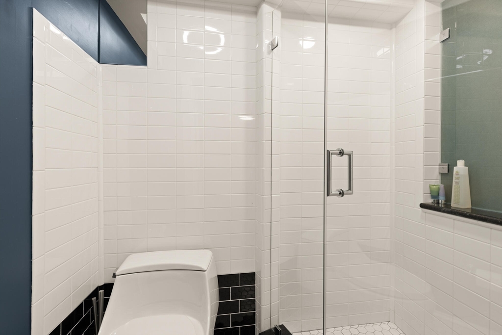 36 Gorham Street, Unit 3 Cambridge, MA 02138 - Photo 20 of 31 a bathroom with a toilet and a shower