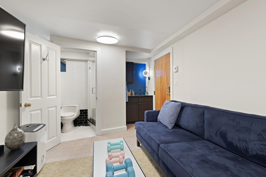 36 Gorham Street, Unit 3 Cambridge, MA 02138 - Photo 21 of 31 a living room with furniture and a couch