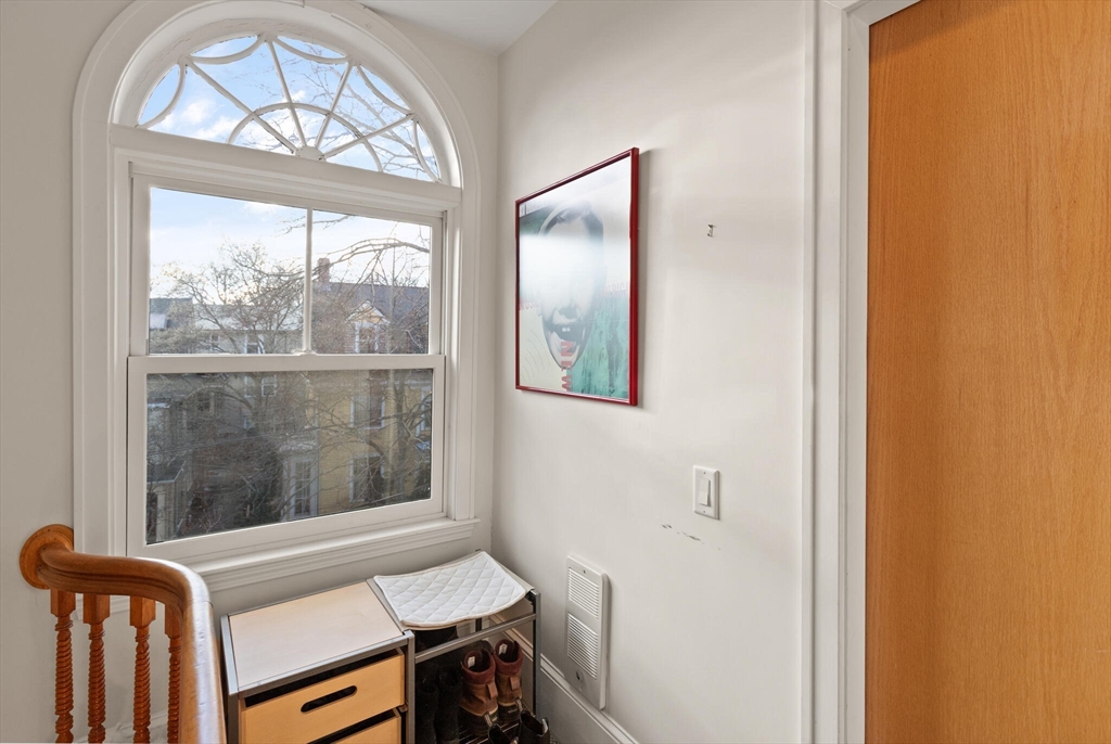 36 Gorham Street, Unit 3 Cambridge, MA 02138 - Photo 30 of 31 a view of a hallway with furniture and a window