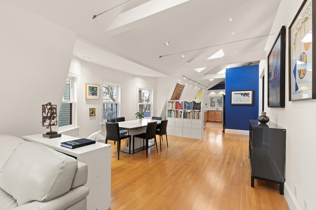 36 Gorham Street, Unit 3 Cambridge, MA 02138 - Photo 5 of 31 a living room with fireplace furniture and a wooden floor