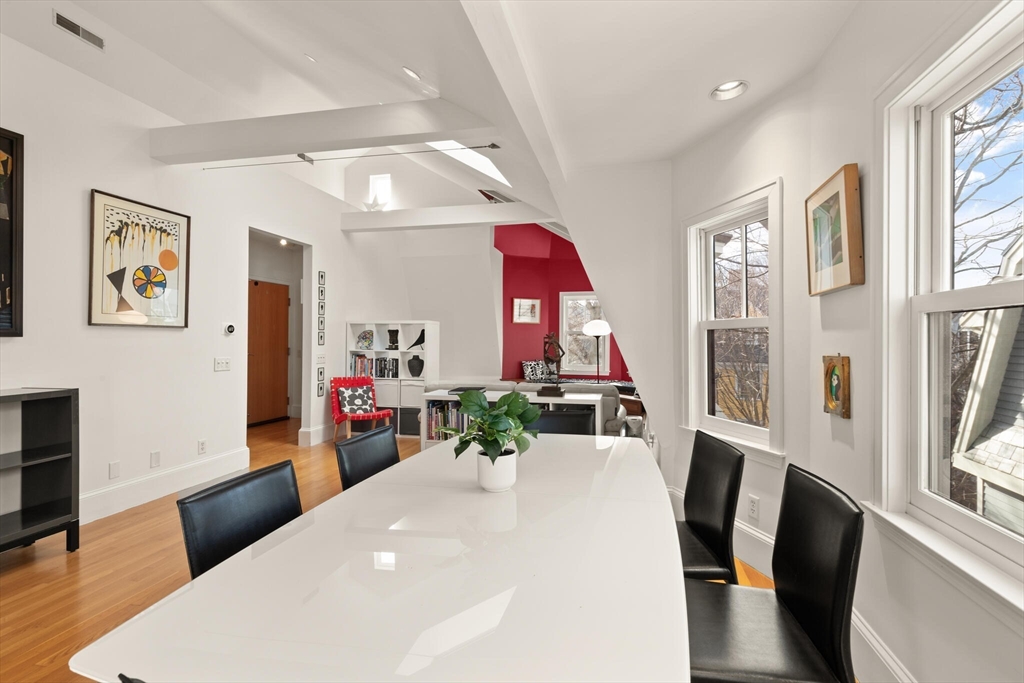 36 Gorham Street, Unit 3 Cambridge, MA 02138 - Photo 8 of 31 a view of a dining room with furniture window and wooden floor