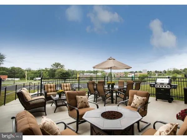 a view of a patio with couches table and chairs