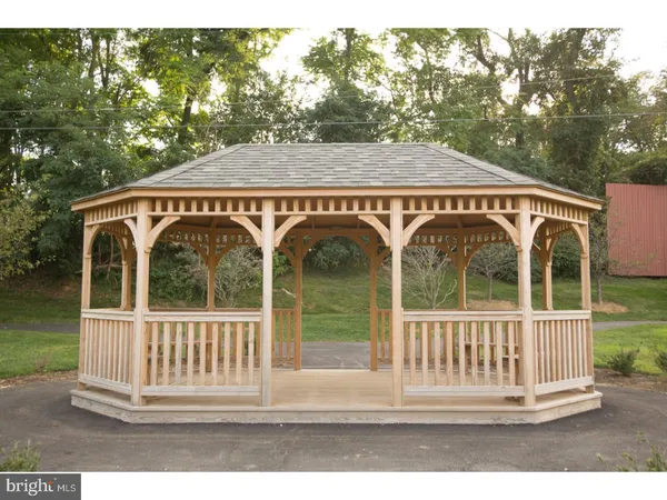 a front view of a residential apartment building with a yard
