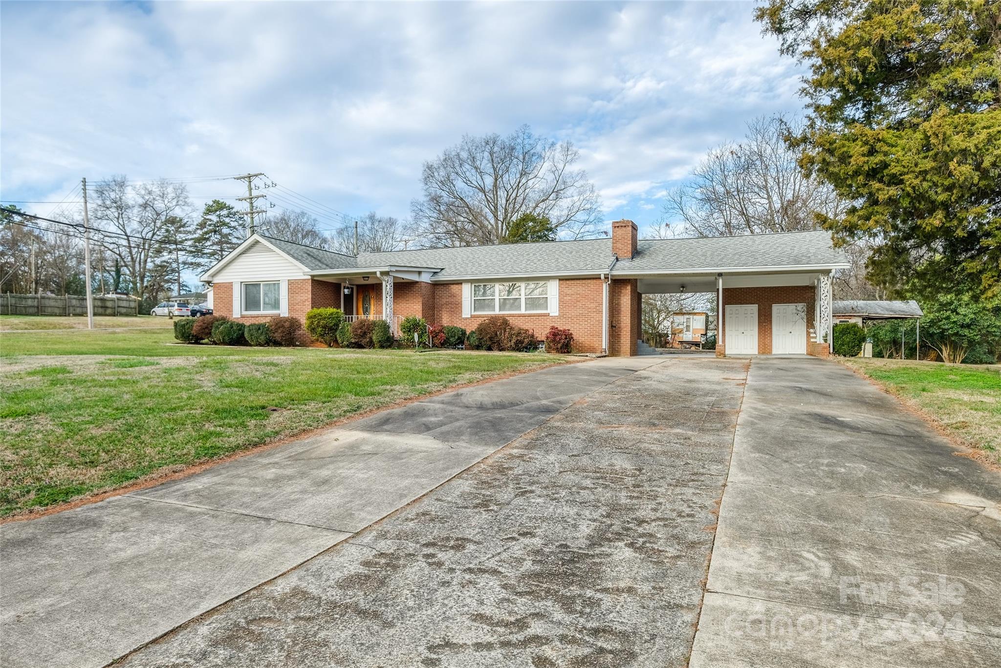 front view of a house next to a yard