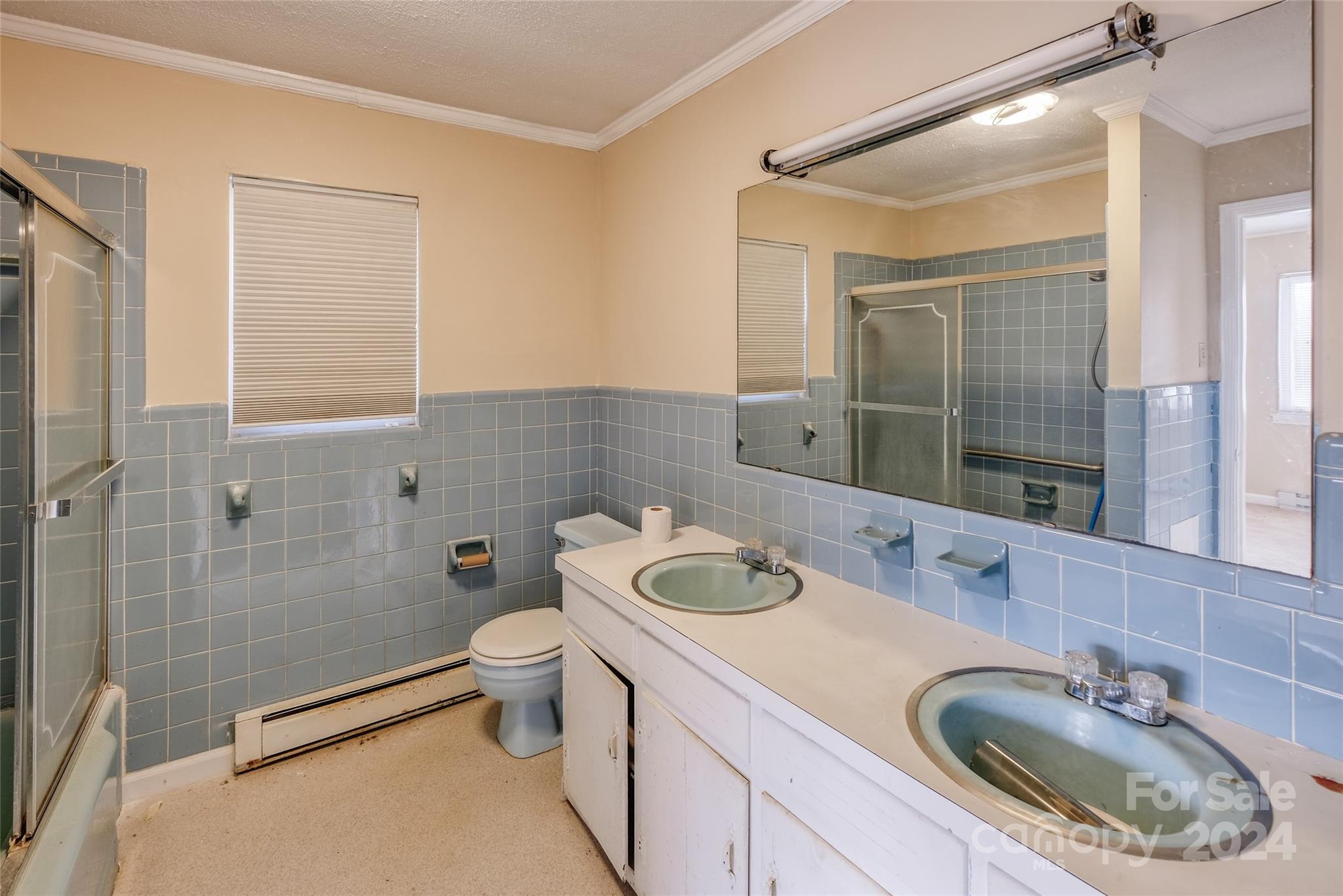 342 Stagecoach Road Northwest Concord, NC 28027 - Photo 17 of 25 a bathroom with a sink a toilet and shower