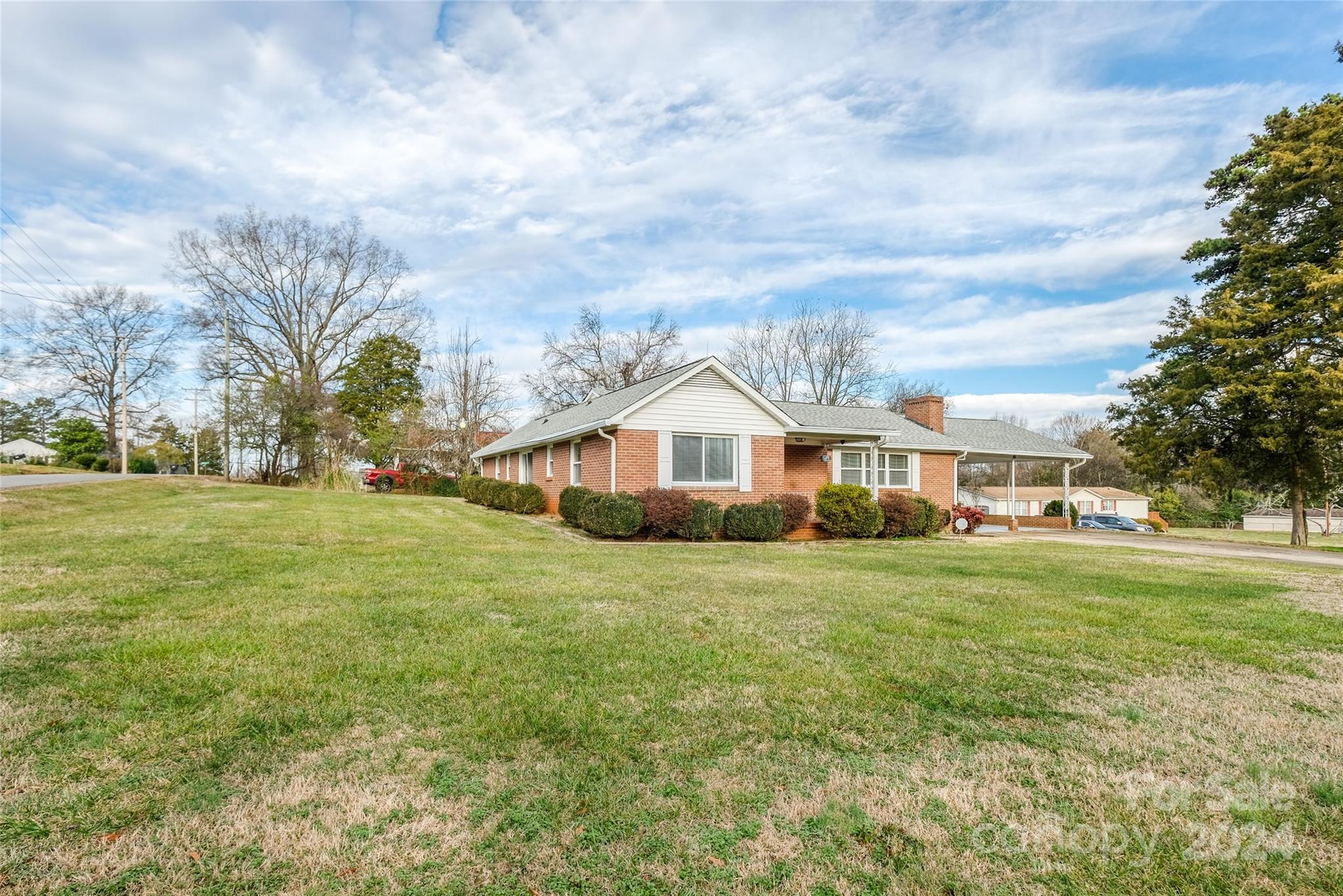 342 Stagecoach Road Northwest Concord, NC 28027 - Photo 22 of 25 a front view of a house with a yard