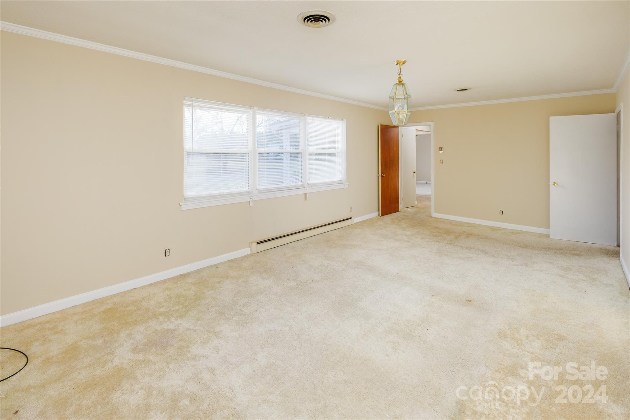 342 Stagecoach Road Northwest Concord, NC 28027 - Photo 3 of 25 a view of an empty room with a window