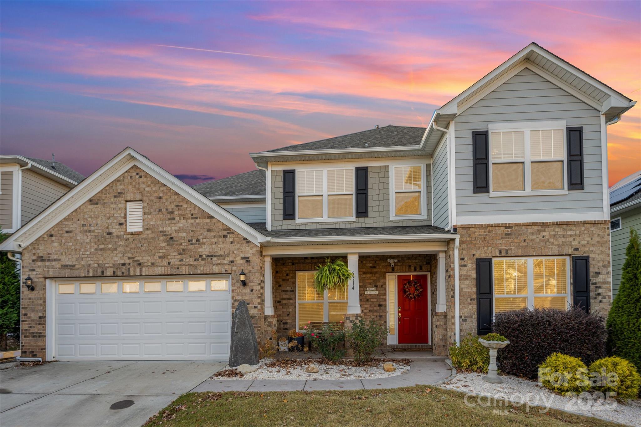 front view of a house with a yard