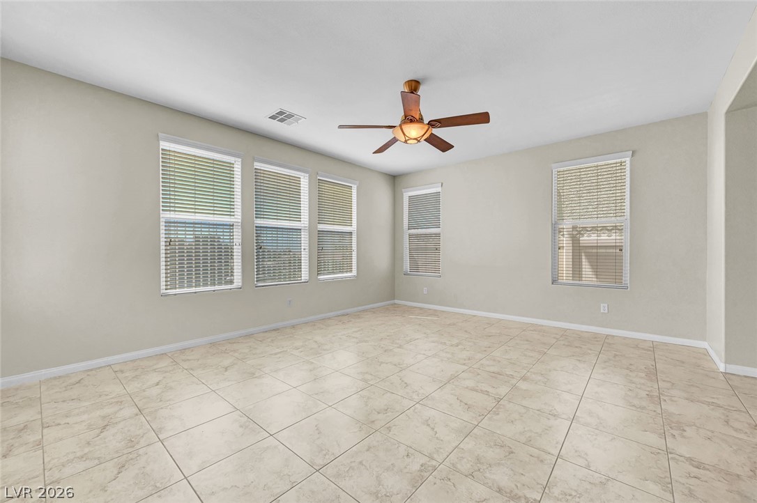 977 Sparkling Light Street Henderson, NV 89052 - Photo 23 of 75 This expansive room offers bright natural light and versatile space.