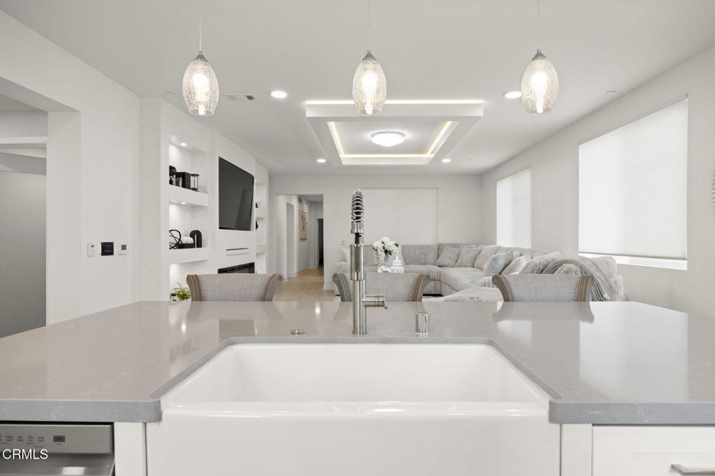 2850 Wagon Wheel Road, Unit 302 Oxnard, CA 93036 - Photo 11 of 50 a living room with furniture and a large mirror