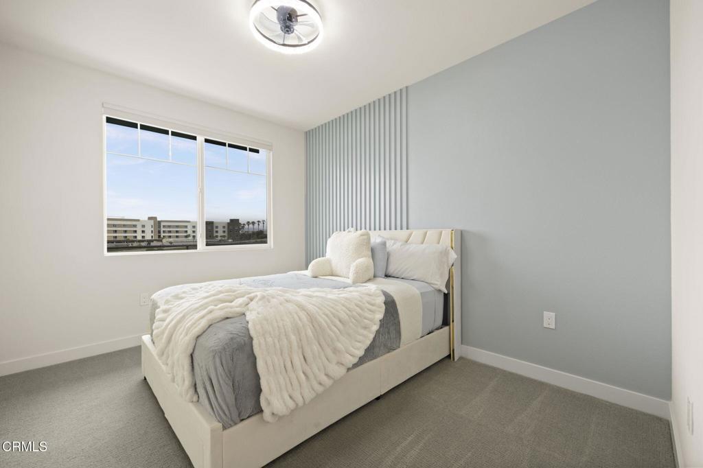 2850 Wagon Wheel Road, Unit 302 Oxnard, CA 93036 - Photo 14 of 50 a bedroom with a bed and a window