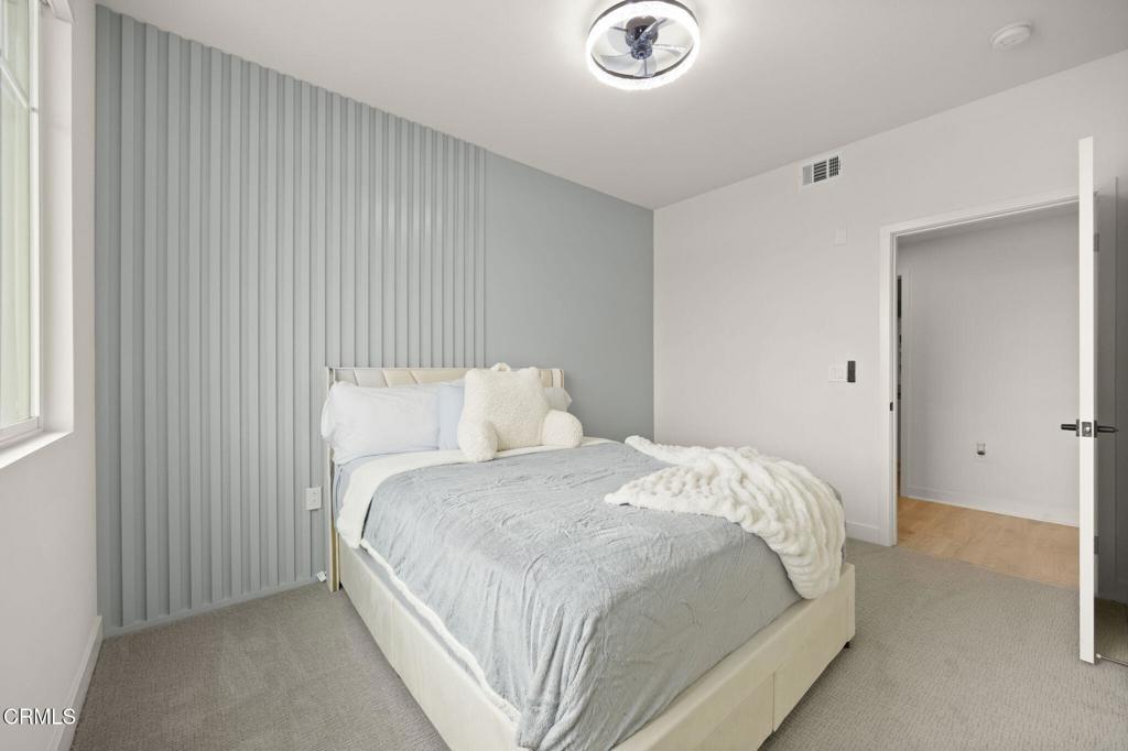 2850 Wagon Wheel Road, Unit 302 Oxnard, CA 93036 - Photo 15 of 50 a bedroom with a bed and a window