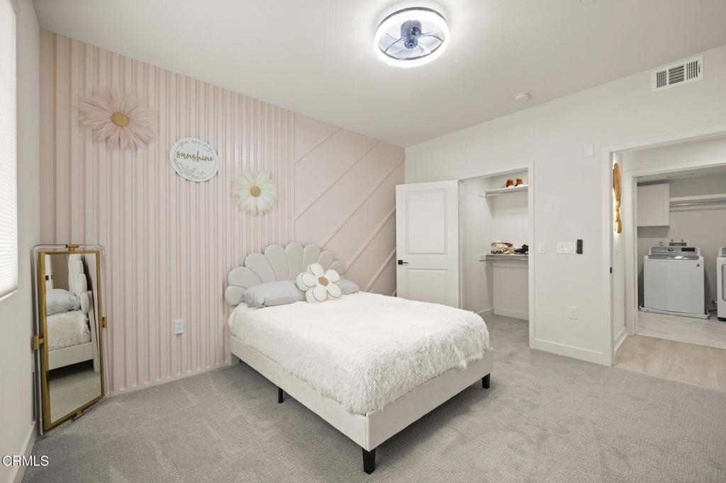 2850 Wagon Wheel Road, Unit 302 Oxnard, CA 93036 - Photo 19 of 50 a bedroom with a bed and a table