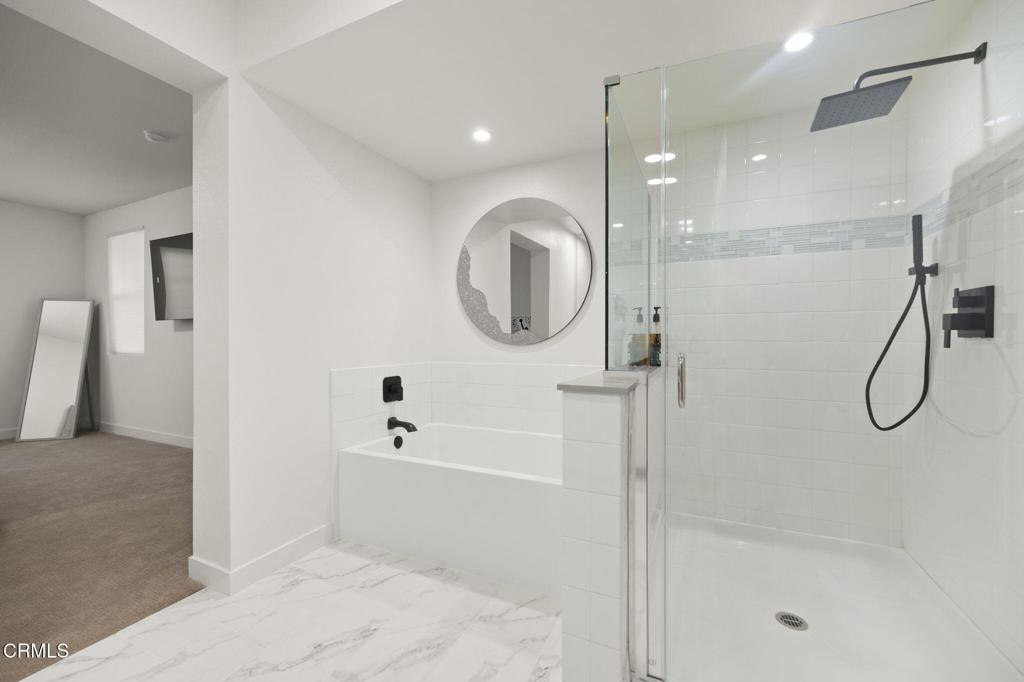 2850 Wagon Wheel Road, Unit 302 Oxnard, CA 93036 - Photo 29 of 50 a bathroom with a tub shower and sink