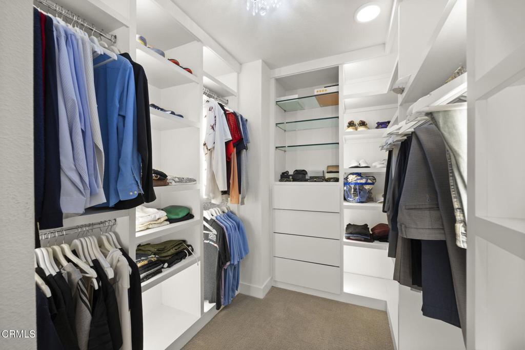 2850 Wagon Wheel Road, Unit 302 Oxnard, CA 93036 - Photo 32 of 50 a view of walk in closet with clothes and shoes