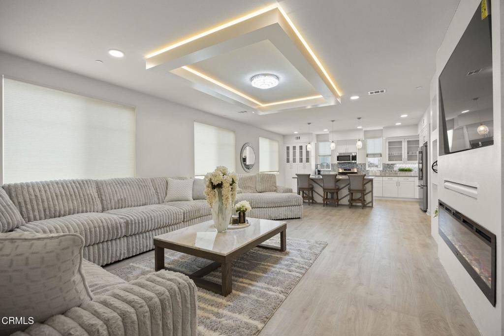 2850 Wagon Wheel Road, Unit 302 Oxnard, CA 93036 - Photo 6 of 50 a living room with furniture and a table