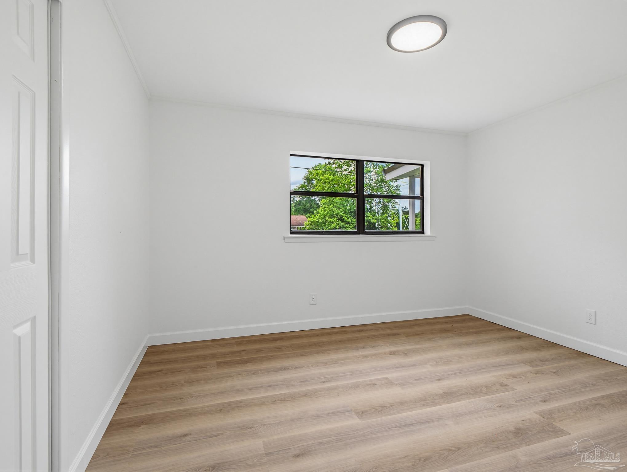 125 Madrid Road Cantonment, FL 32533 - Photo 11 of 16 an empty room with windows
