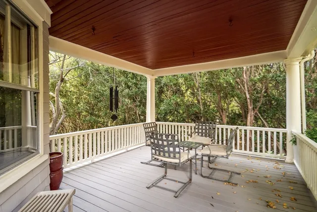 a view of a chair and table in the deck