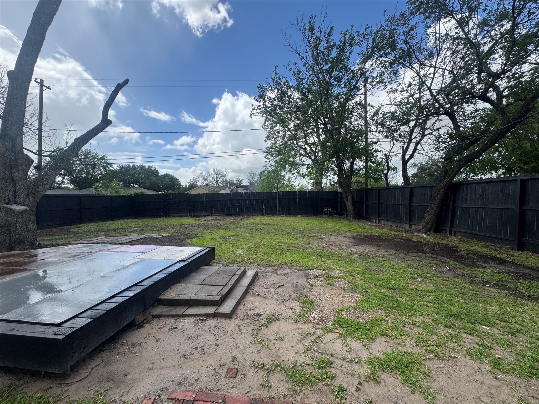 6645 Lodge Street Houston, TX 77092 - Photo 8 of 9 a view of a backyard with hardwood