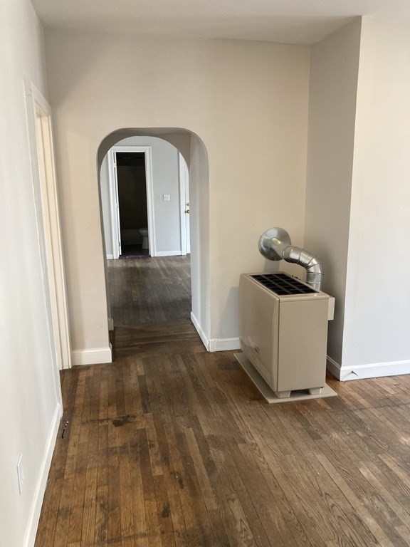946 Rodman Street Fall River, MA 02721 - Photo 8 of 18 a view of a room that has a rug and a window