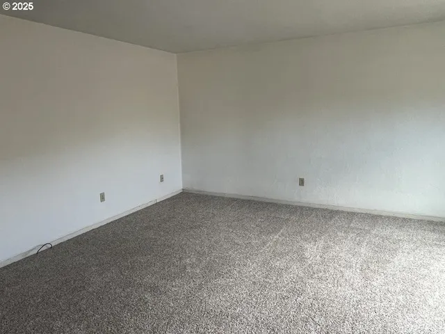 a kitchen with a sink window and cabinets