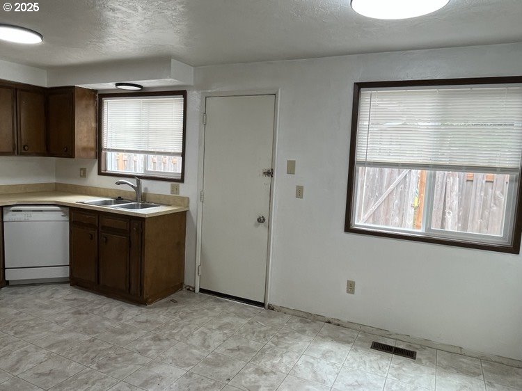 2801 Raleigh Court Southeast Albany, OR 97322 - Photo 20 of 30 a kitchen with a sink window and cabinets
