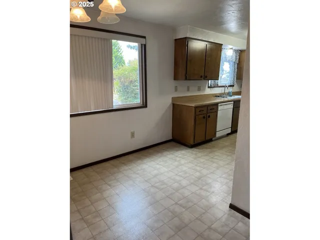 a kitchen with a stove and a microwave