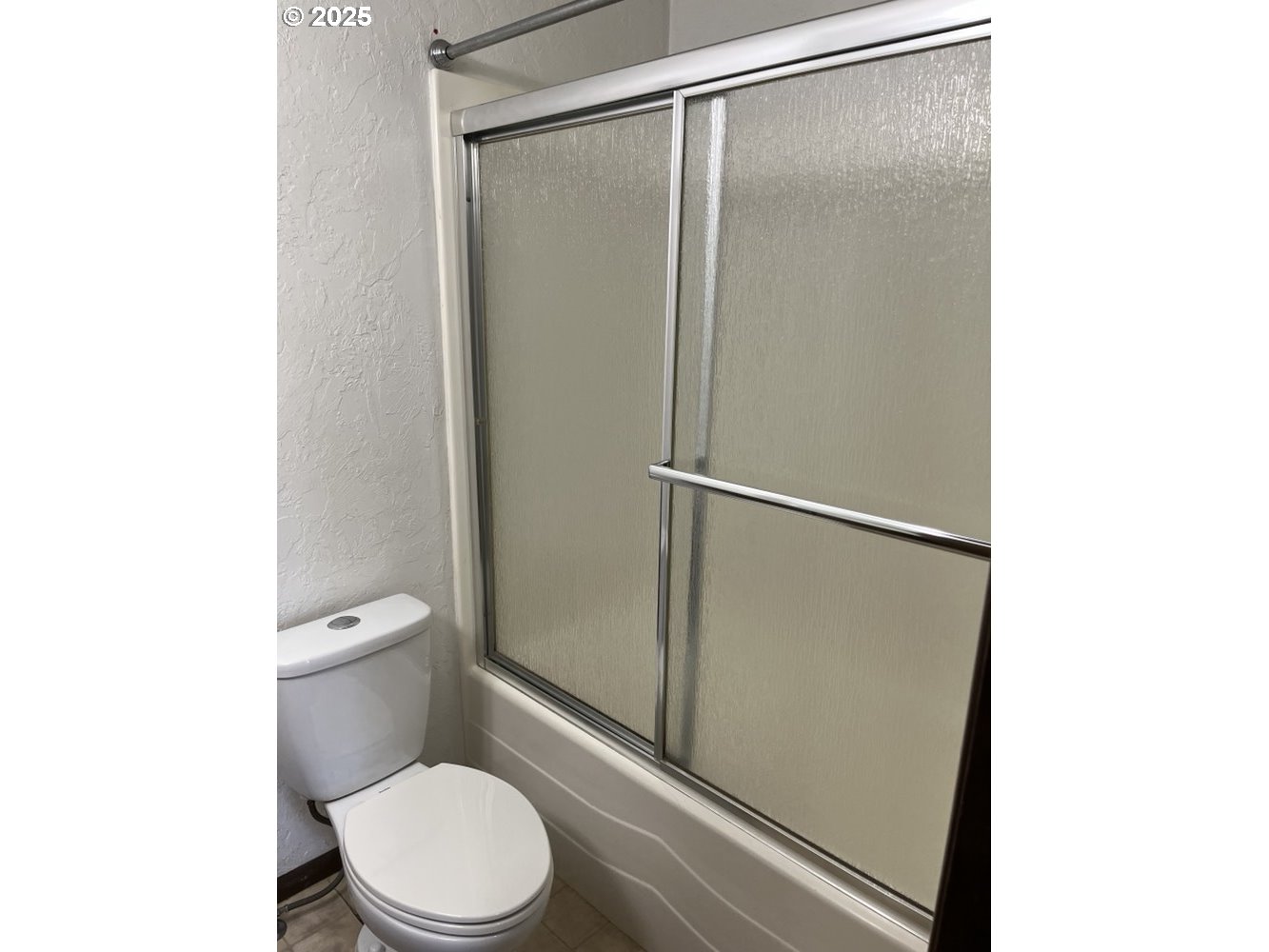 2801 Raleigh Court Southeast Albany, OR 97322 - Photo 8 of 30 a white toilet sitting next to a shower