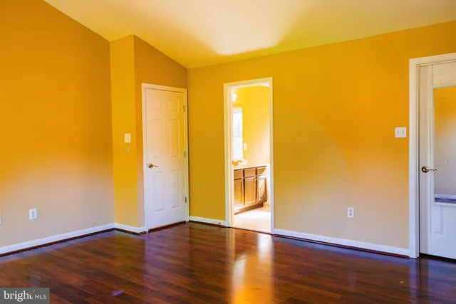 a view of a bathroom with wooden floor