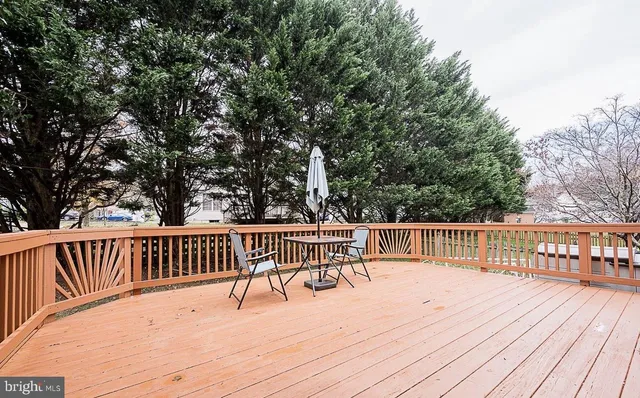 a view of a deck with wooden floor and fence