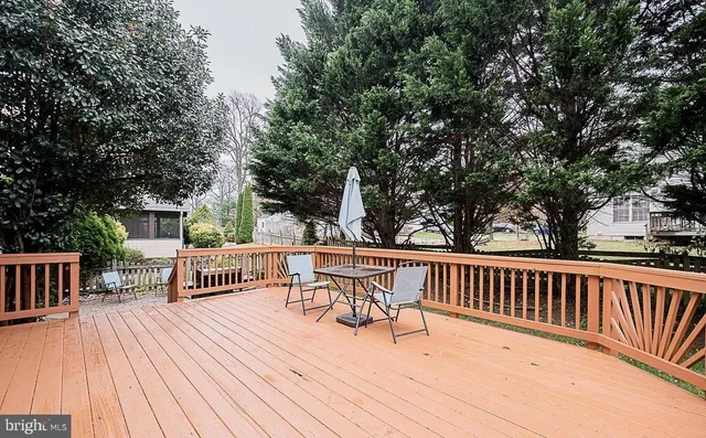 a view of a chairs and table on the deck