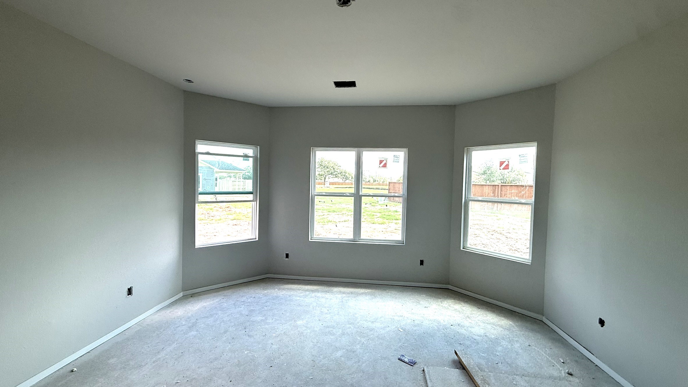 19226 Trinity Terrace Ln Spring Spring, TX 77379 - Photo 12 of 21 Large, energy-efficient windows invite natural light to fill the room, enhancing the airy, open feel while preserving privacy.