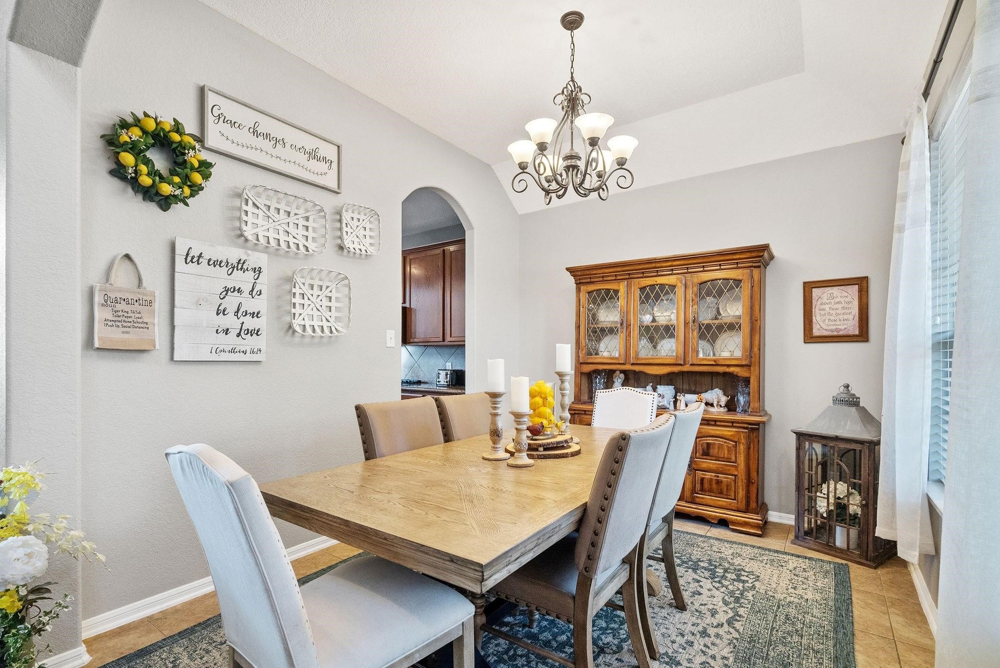 62 West Lasting Spring Circle The Woodlands, TX 77389 - Photo 12 of 46 a view of a dining room with furniture and a chandelier