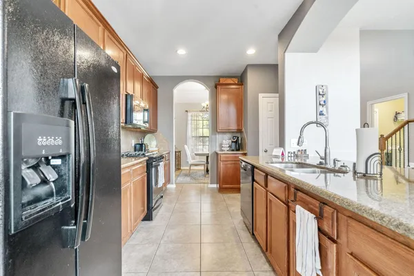 a large kitchen with lots of counter space and windows