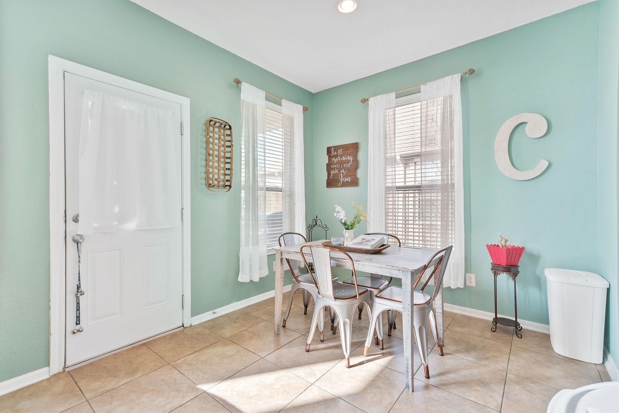 62 West Lasting Spring Circle The Woodlands, TX 77389 - Photo 20 of 46 a view of a dining room with furniture and window