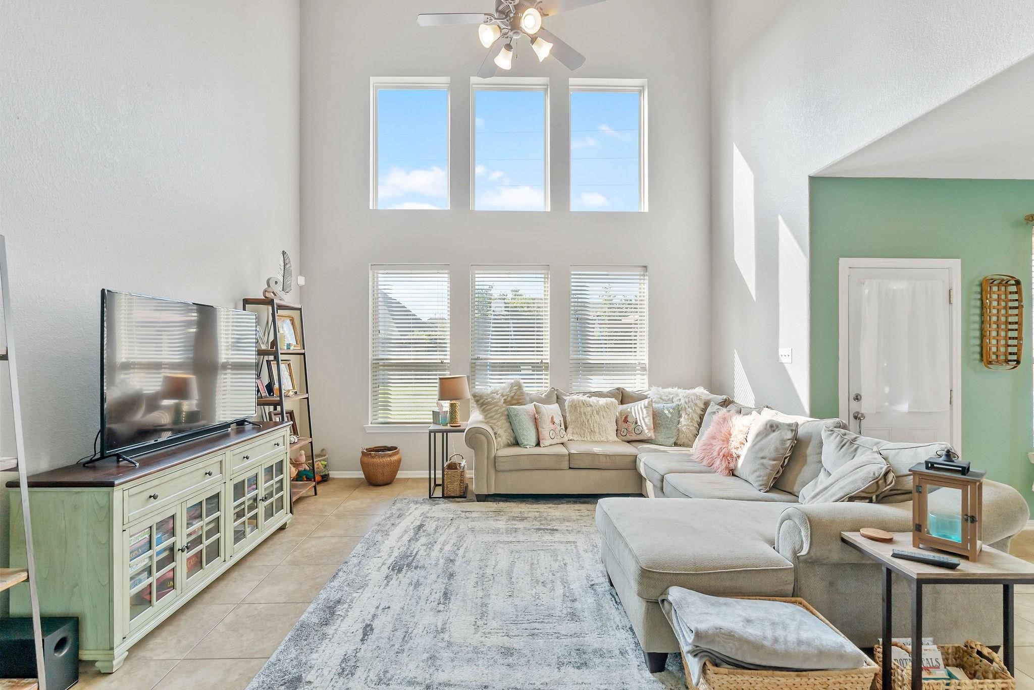 62 West Lasting Spring Circle The Woodlands, TX 77389 - Photo 23 of 46 a living room with furniture and a flat screen tv