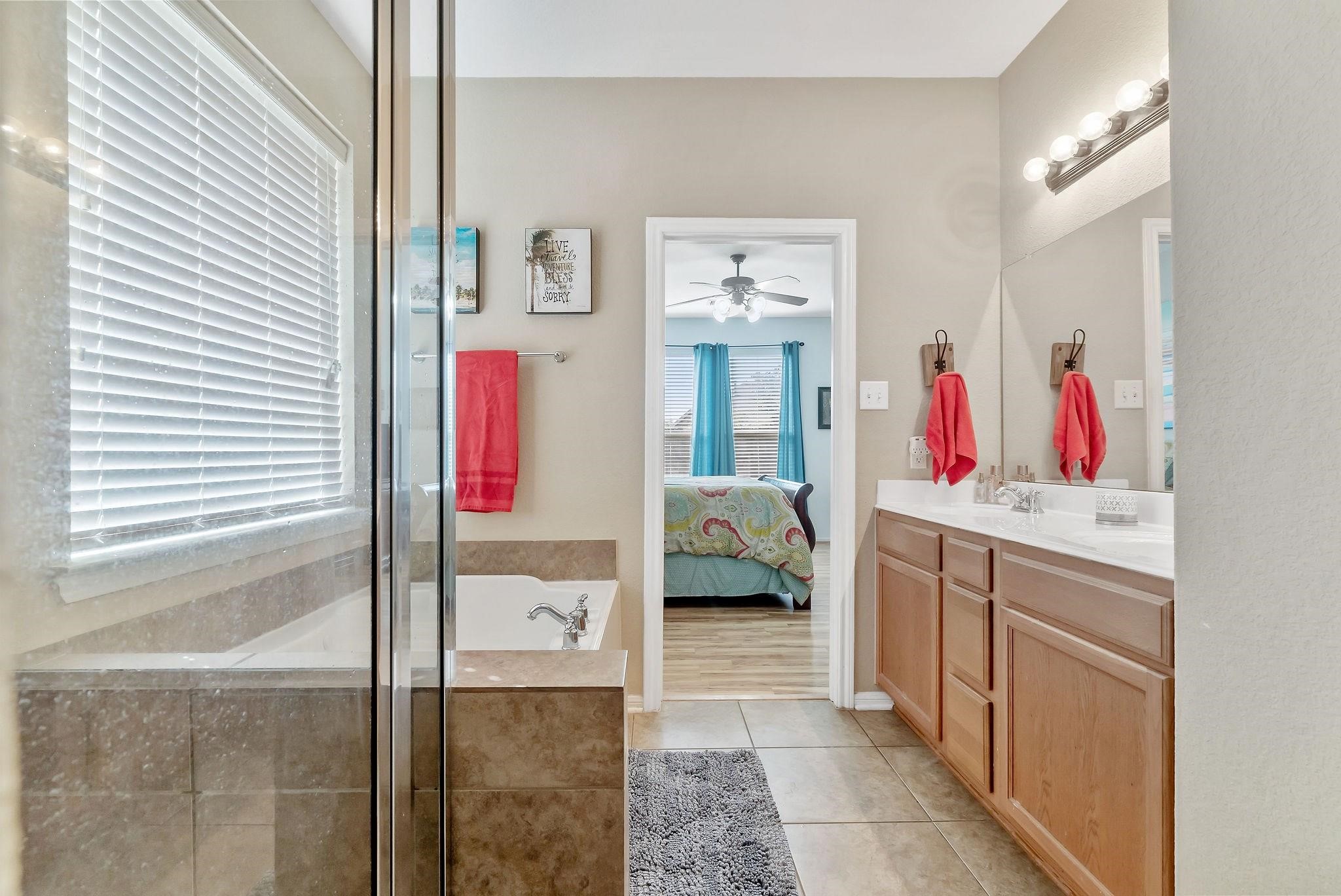 62 West Lasting Spring Circle The Woodlands, TX 77389 - Photo 31 of 46 a room that has a bed and a walk in closet