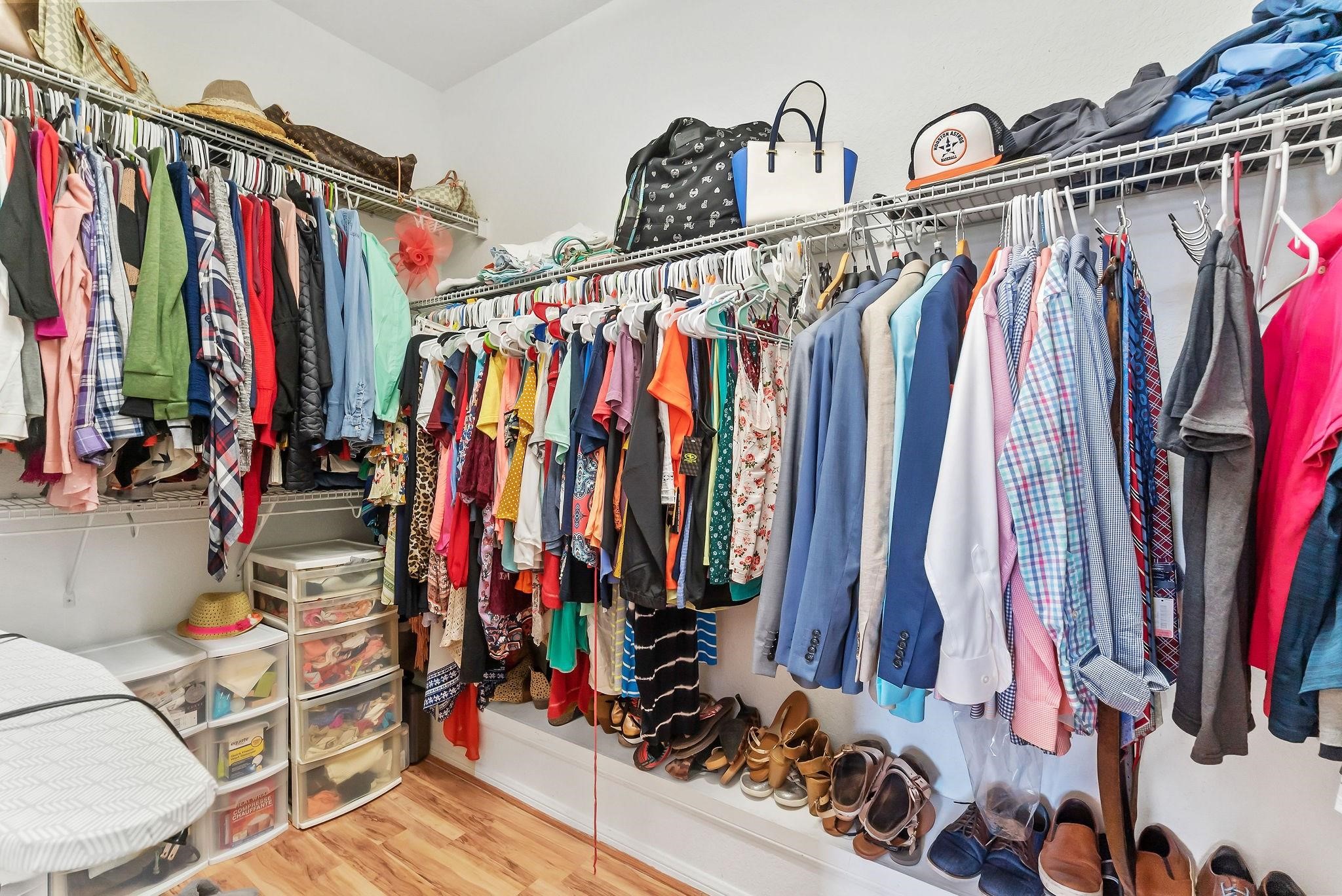 62 West Lasting Spring Circle The Woodlands, TX 77389 - Photo 32 of 46 a view of walk in closet with clothes
