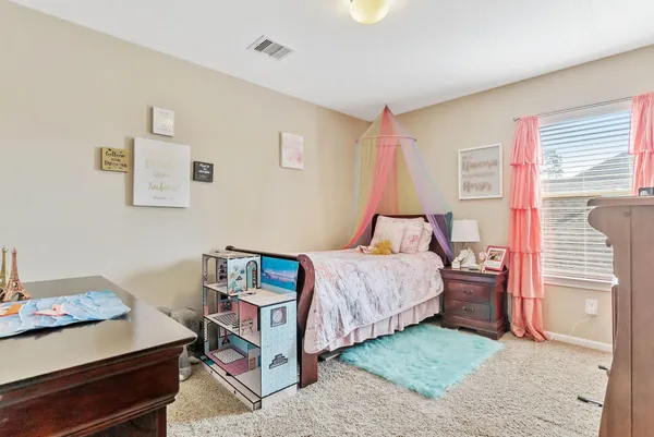 a view of a livingroom with furniture and a window