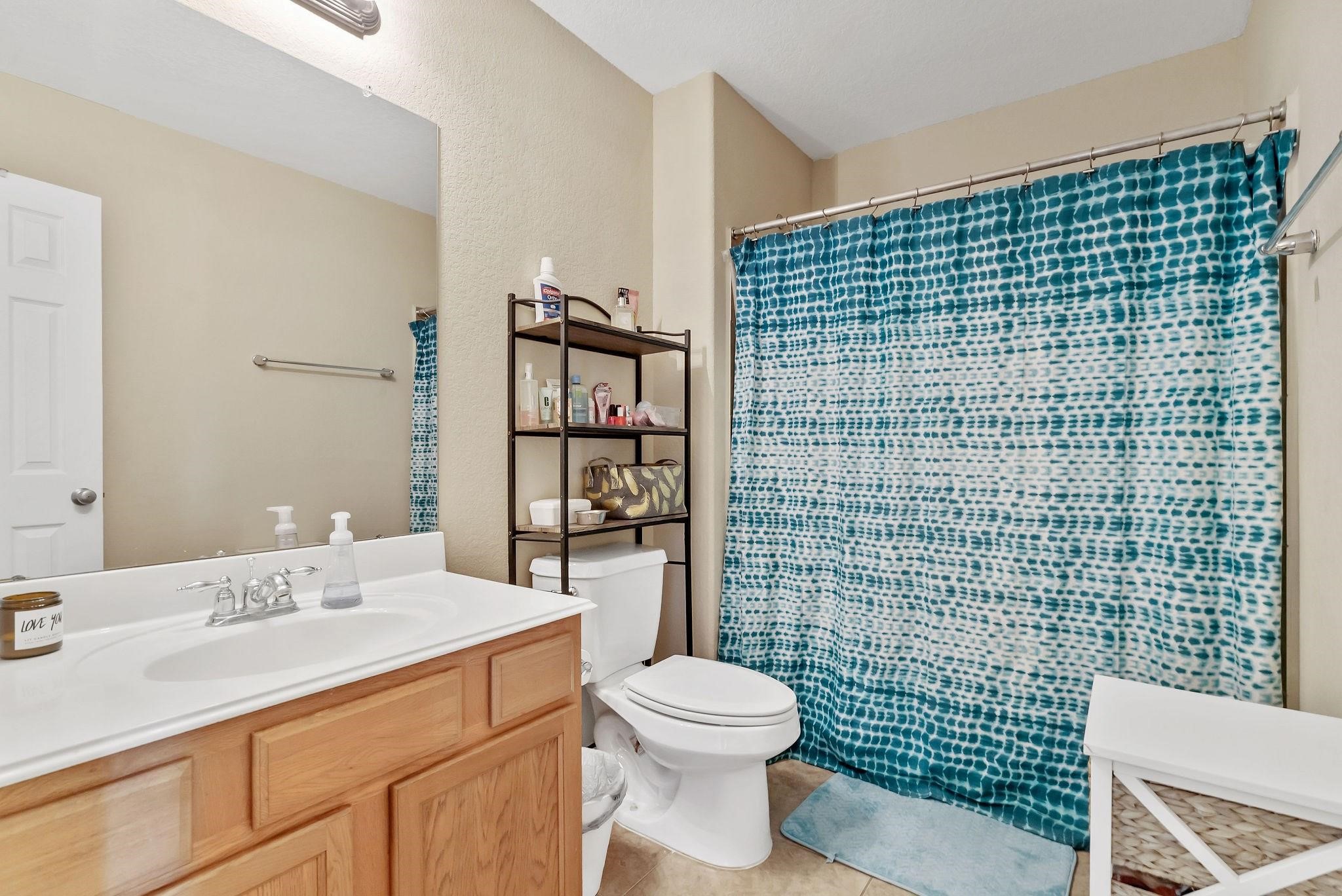 62 West Lasting Spring Circle The Woodlands, TX 77389 - Photo 36 of 46 a bathroom with a sink toilet and shower