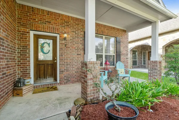a front view of a house with garden