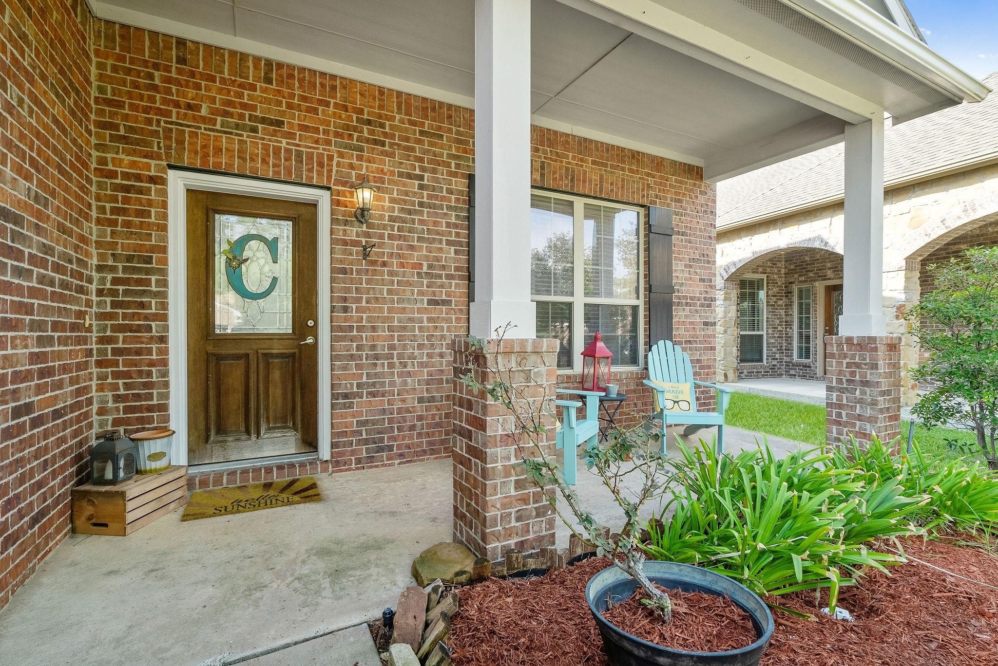62 West Lasting Spring Circle The Woodlands, TX 77389 - Photo 5 of 46 a front view of a house with garden