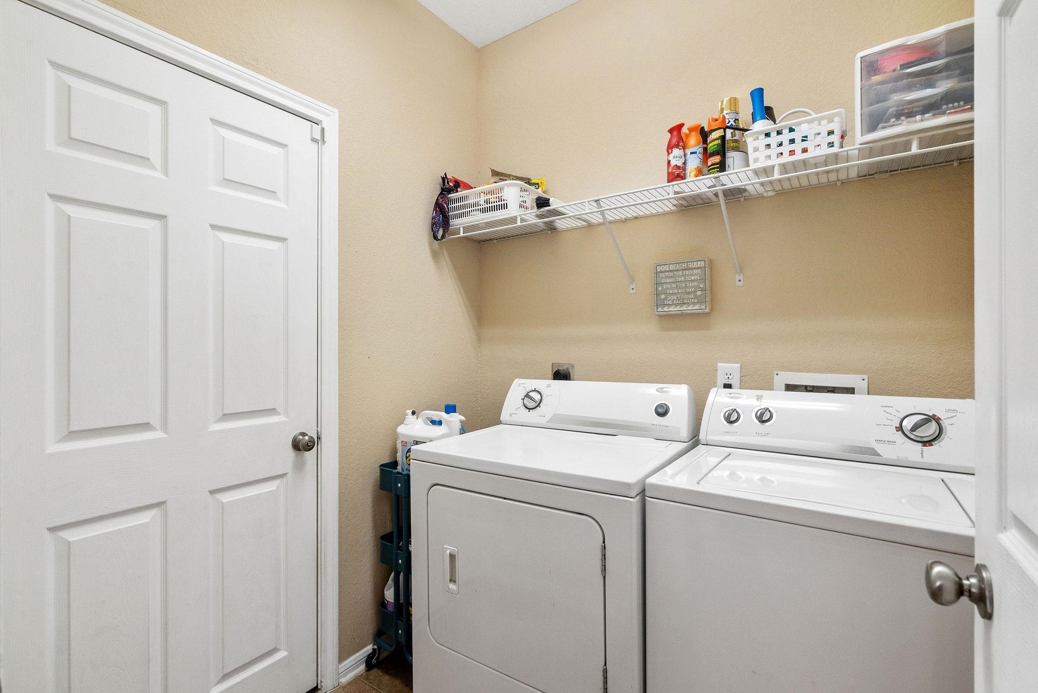 62 West Lasting Spring Circle The Woodlands, TX 77389 - Photo 10 of 46 a utility room with dryer and washer
