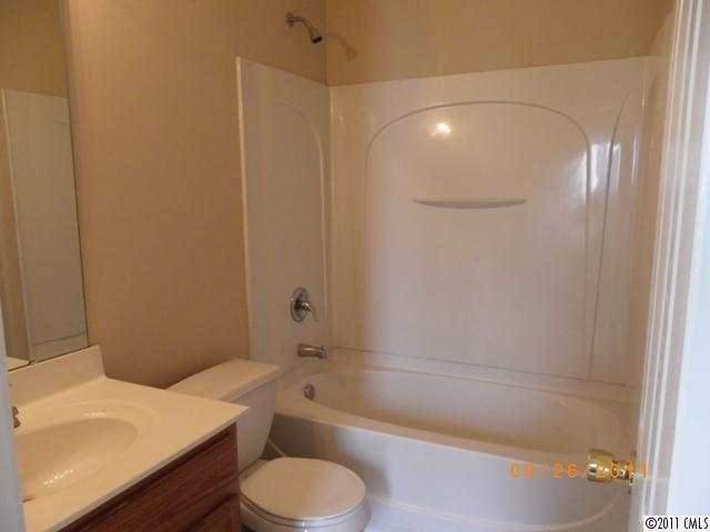 2766 Rustic Ridge Court Rock Hill, SC 29730 - Photo 12 of 13 a bathroom with a sink a toilet and shower