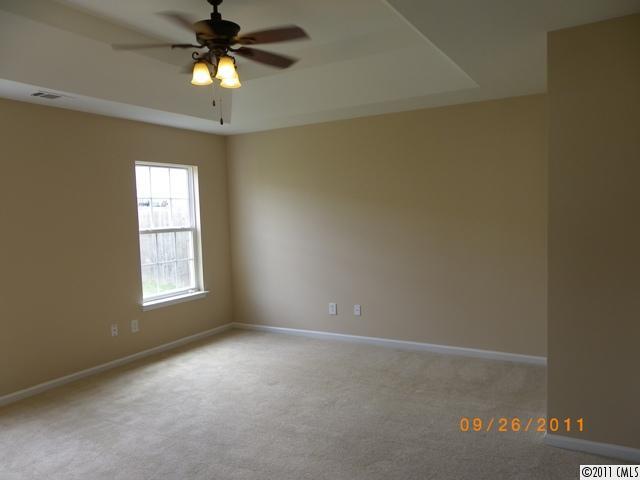 2766 Rustic Ridge Court Rock Hill, SC 29730 - Photo 6 of 13 an empty room with a window and a fan