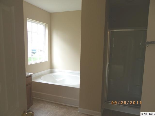 2766 Rustic Ridge Court Rock Hill, SC 29730 - Photo 8 of 13 a bathroom with a bathtub and shower