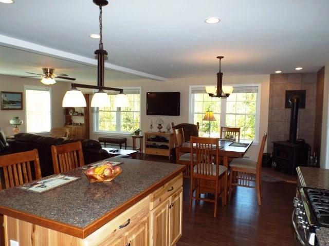299 Folly Road Sebago, ME 04029 - Photo 8 of 35 Kitchen into dining area and living...