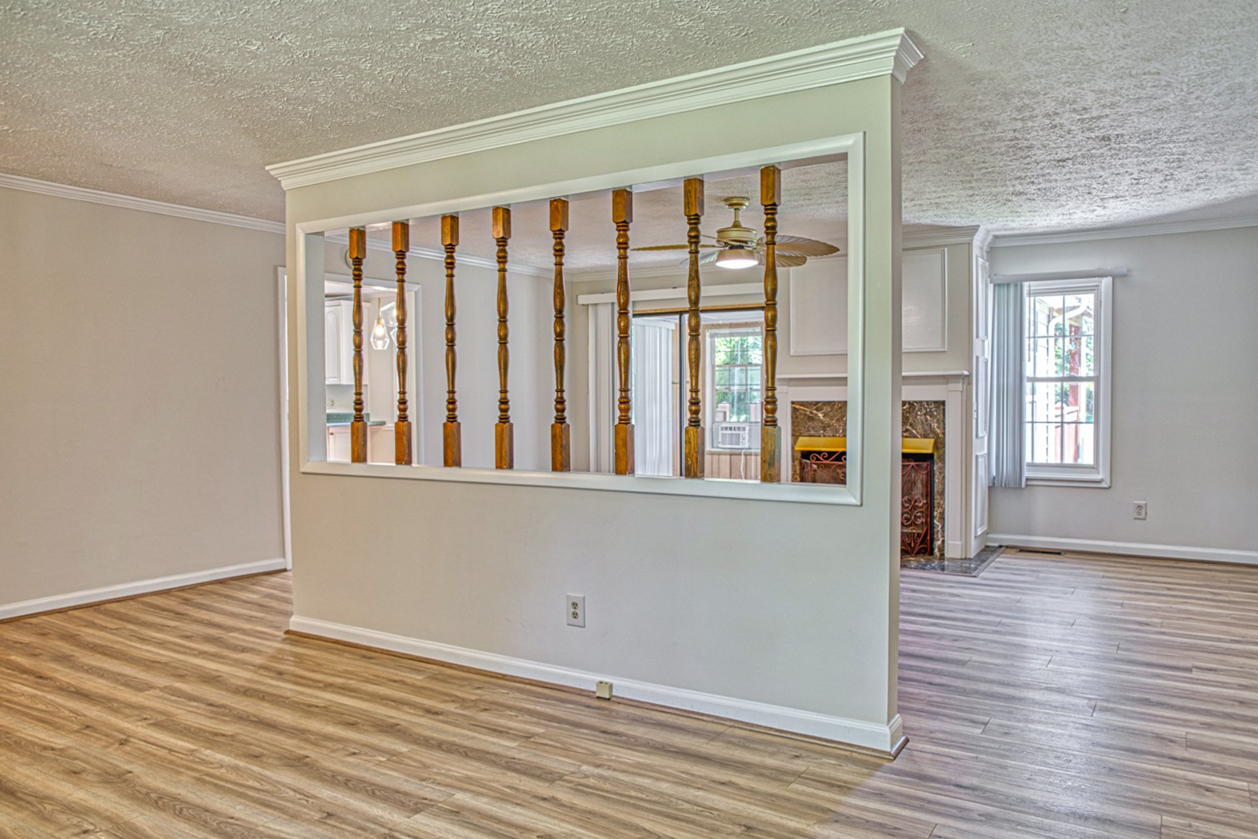 2085 Herbert Garrett Road Cookeville, TN 38506 - Photo 8 of 39 a view of an empty room with wooden floor and a window